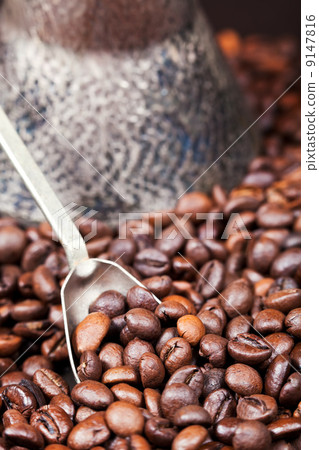 spoon scoops roasted coffee beans spoon scoops roasted coffee beans 9147816