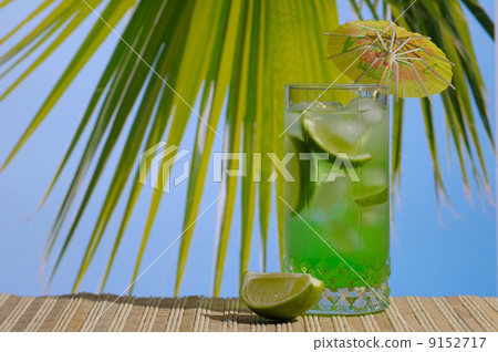 Mojito cocktail against blue sky Mojito cocktail against blue sky 9152717