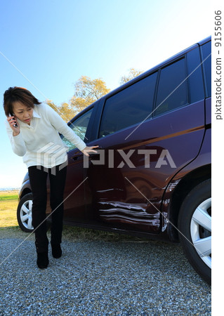 A woman hitting a car 9155606