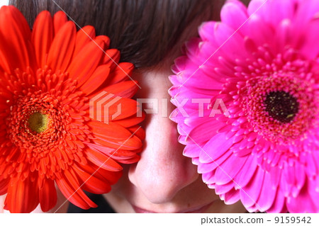 Young blond woman with flowers in her hands 9159542