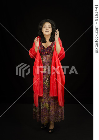 Dramatic actress performs on stage 9163441