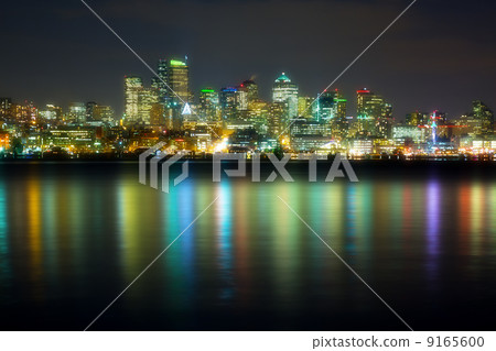 panorama of the city at night reflected in water, Seattle, USA panorama of the city at night reflected in water, Seattle, USA 9165600