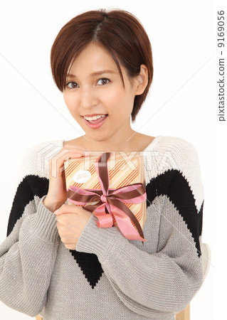 A woman with a present A woman with a present 9169056