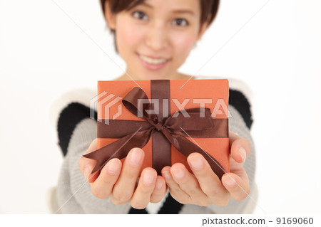 A woman giving a gift 9169060