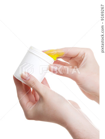 ointment in hand, isolated on white background ointment in hand, isolated on white background 9169267