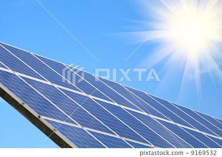 Solar panel against blue sky with sun Solar panel against blue sky with sun 9169532