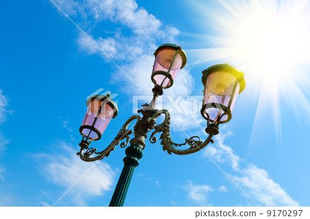 old street-lamp on blue sky with sunlight in Venice 9170297