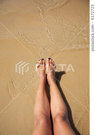 legs in ocean at Conil beach 9172723