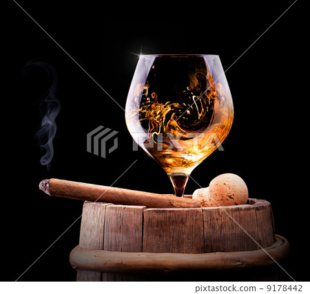 Cognac and Cigar on black with vintage barrel 9178442