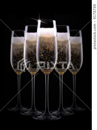 champagne glass on black background champagne glass on black background 9178789