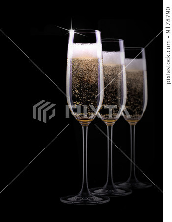 champagne glass on black background champagne glass on black background 9178790