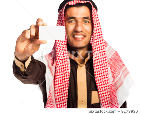 Young smiling arab showing business card in hand isolated on whi Young smiling arab showing business card in hand isolated on whi 9179950
