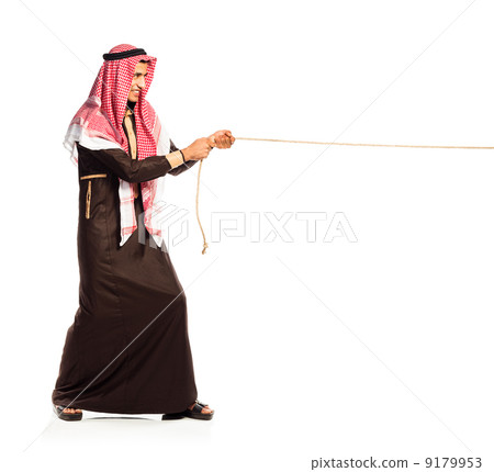 Young Arab pulling a rope isolated on white Young Arab pulling a rope isolated on white 9179953