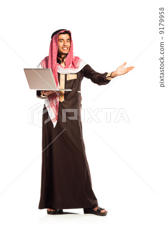 Young smiling arab with laptop isolated on white Young smiling arab with laptop isolated on white 9179958