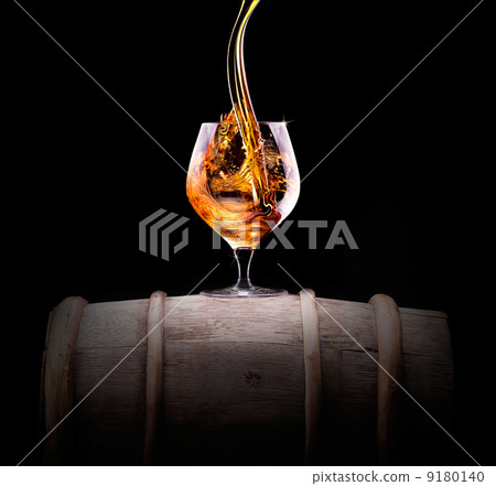 Cognac or brandy on a black Cognac or brandy on a black 9180140