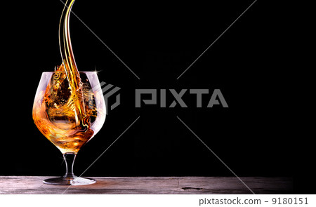 Cognac or brandy on a black Cognac or brandy on a black 9180151