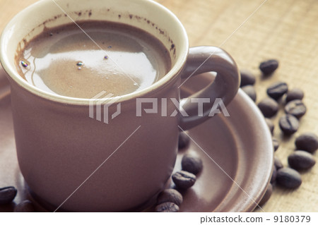 Cup of Coffee with beans on wood background Cup of Coffee with beans on wood background 9180379