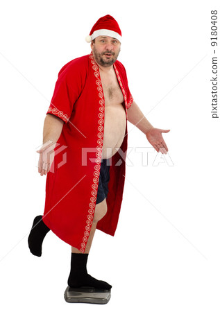 Bearded Santa standing on weight scales 9180408