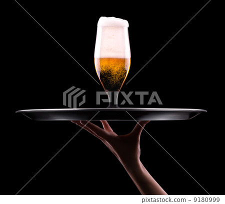 Beer into glass on a black Beer into glass on a black 9180999