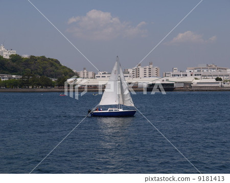 A view of a yacht sailing at Yokosuka Port A view of a yacht sailing at Yokosuka Port 9181413