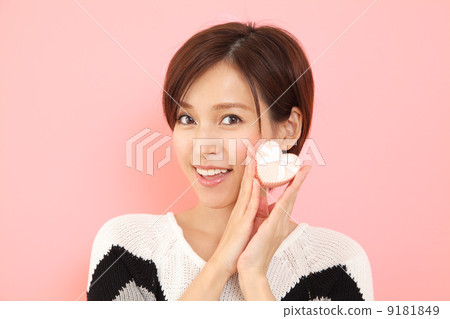 A woman with a heart-shaped gift A woman with a heart-shaped gift 9181849