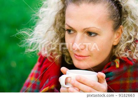 woman holding a cup woman holding a cup 9182663