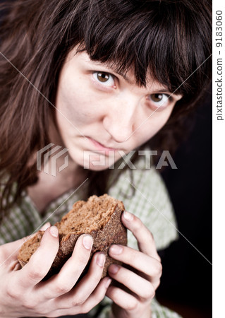 beggar woman with a piece of bread 9183060