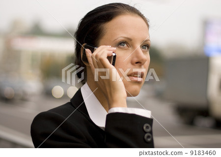businesswoman talking by mobile phone 9183460