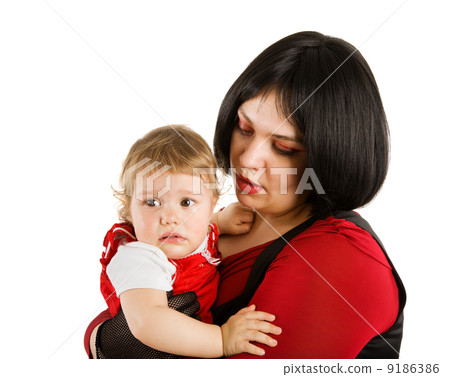 Mother holding crying baby Mother holding crying baby 9186386