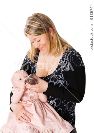 Mother feeding baby 9186744