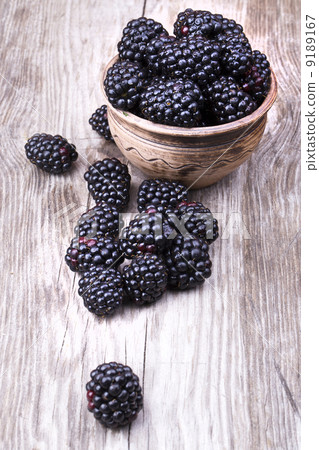 blackberries on wooden table blackberries on wooden table 9189167