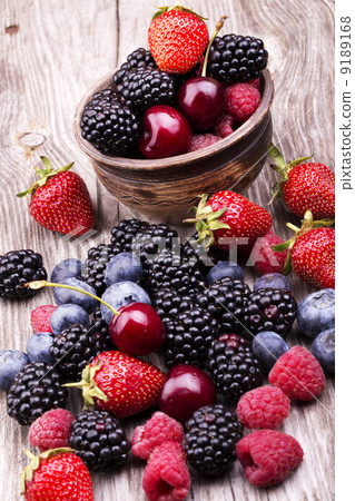 tasty summer fruits on a wooden table tasty summer fruits on a wooden table 9189168