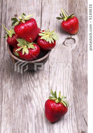 Fresh strawberries on wooden table 9189638