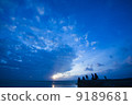 People who watch the sunset at the western pier of Taketomi-jima 9189681