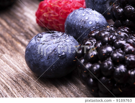 tasty summer fruits on a wooden table tasty summer fruits on a wooden table 9189763