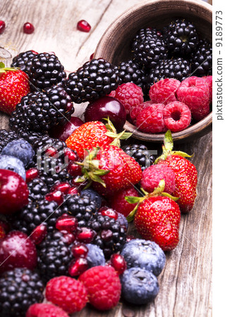 tasty summer fruits on a wooden table tasty summer fruits on a wooden table 9189773