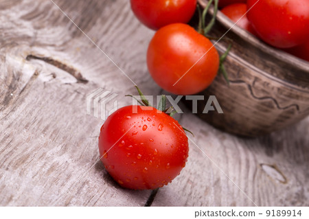 Cherry tomatoes on wooden table 9189914