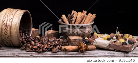 Chocolate bar and spices on wooden table 9191146
