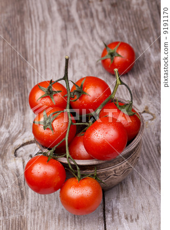 Cherry tomatoes on wooden table Cherry tomatoes on wooden table 9191170
