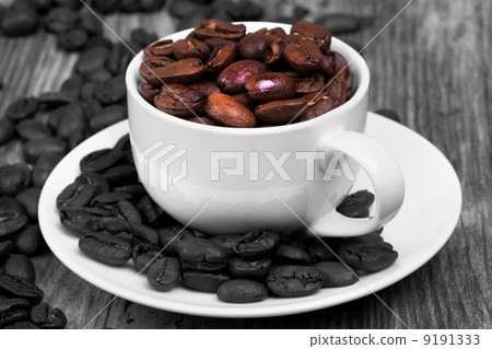 white cup of espresso full of coffee beans white cup of espresso full of coffee beans 9191333