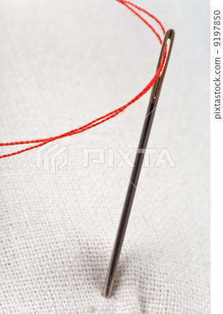 needle with red thread needle with red thread 9197850