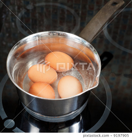 hen eggs are cooked in metal pot 9197905