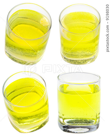 glass of yellow carbonated water with vitamin 9198030