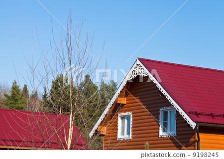 red tile roofs of new wooden houses 9198245