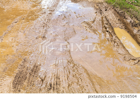 mud and puddle at dirt road mud and puddle at dirt road 9198504