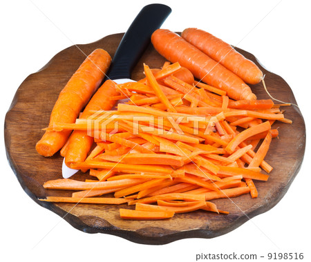 cutting board with sliced carrot and ceramic knife 9198516