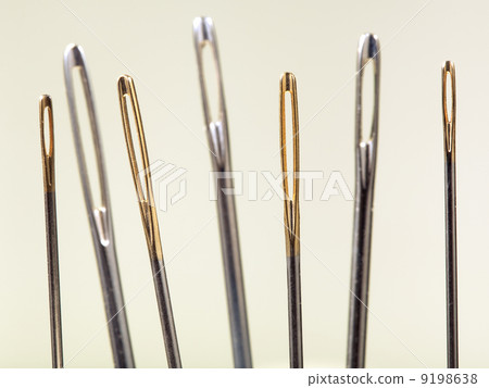 needle's eyes with yellow background 9198638