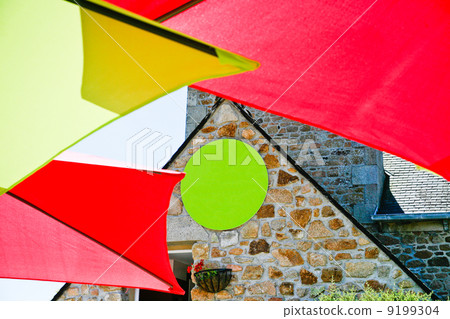 colour umbrella and stone wall 9199304