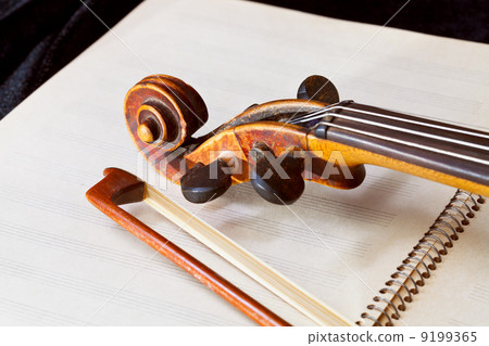 fiddle bow and scroll on music book fiddle bow and scroll on music book 9199365