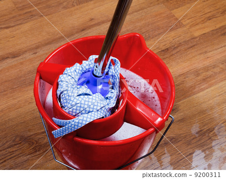 mop in red bucket with water mop in red bucket with water 9200311